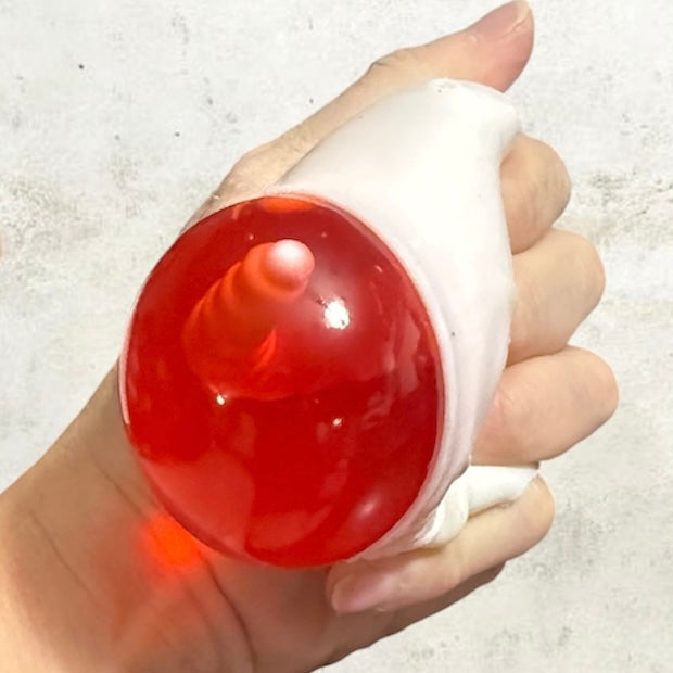 GLOW-IN-THE-DARK HORROR SKULL SQUISHY WITH SURPRISES